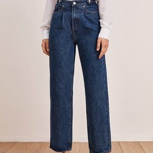 Medium wash straight / wide leg jean